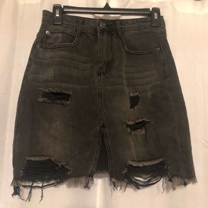 Distressed black jean skirt